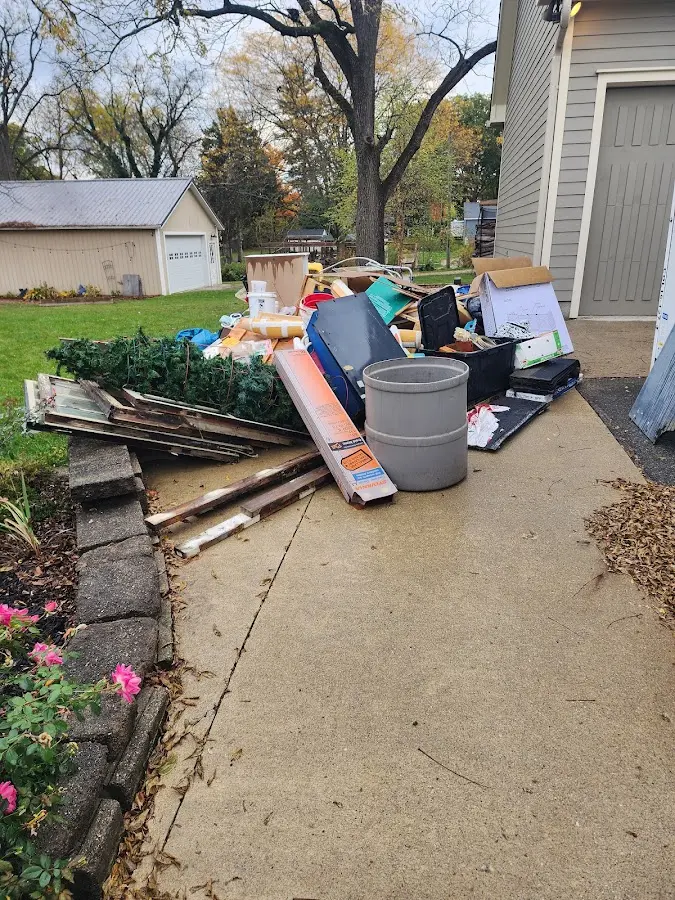 Dumpster being loaded with debris for Roofing Dumpster Rental in Incline Village